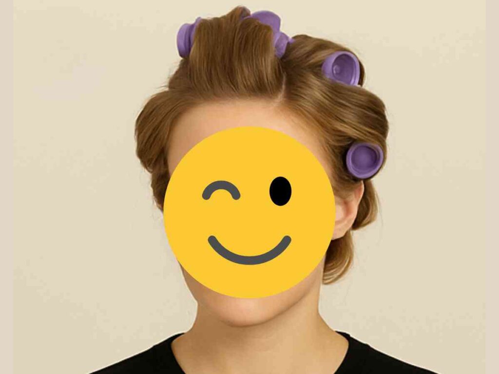 curl hair with hot rollers Person with hair in hot roll curlers, face covered by a winking smiley emoji.