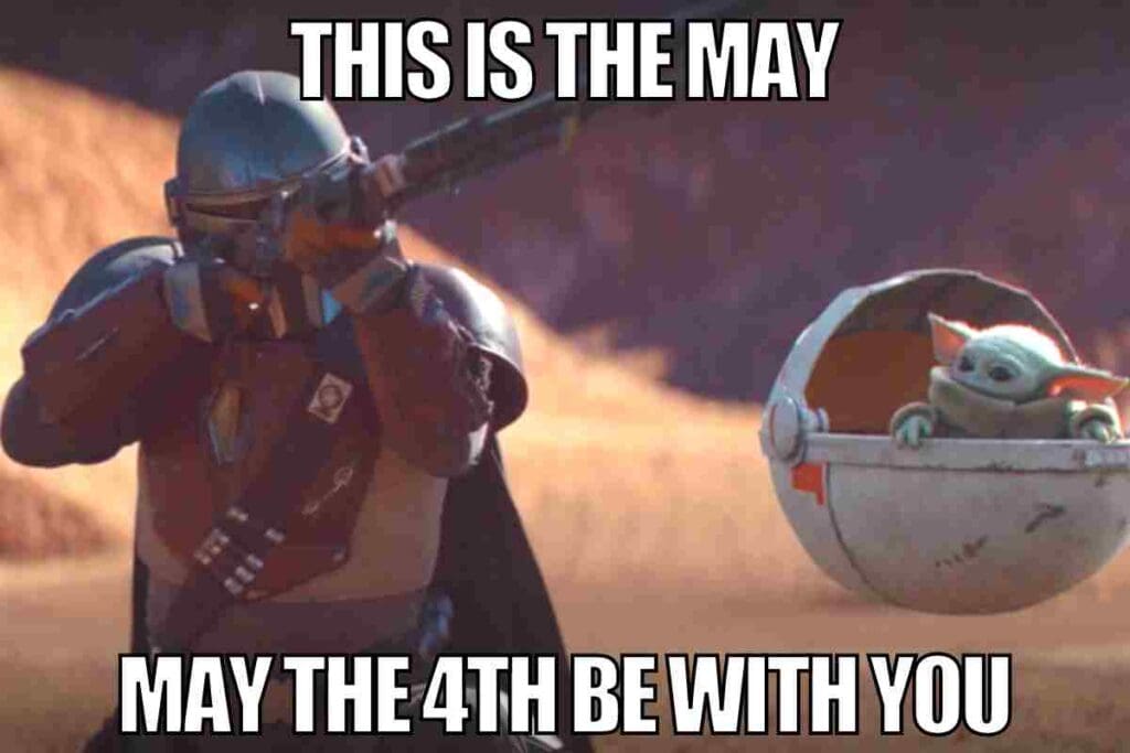 may the 4th mandalorian meme Star Wars meme featuring a Mandalorian character aiming with a blaster while Baby Yoda looks on humorously from his floating pod, with text saying 'This is the May' and 'May the 4th be with you.'