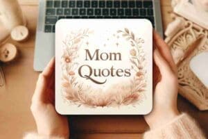 Meme image showing a decorative card with the text 'Mom Quotes' held in front of a laptop, emphasizing heartfelt or humorous sayings related to moms.