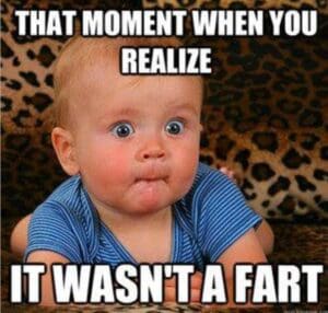 Meme of a wideeyed baby in a striped shirt with the text: 'That Moment When You Realize It Wasn't a Fart'.