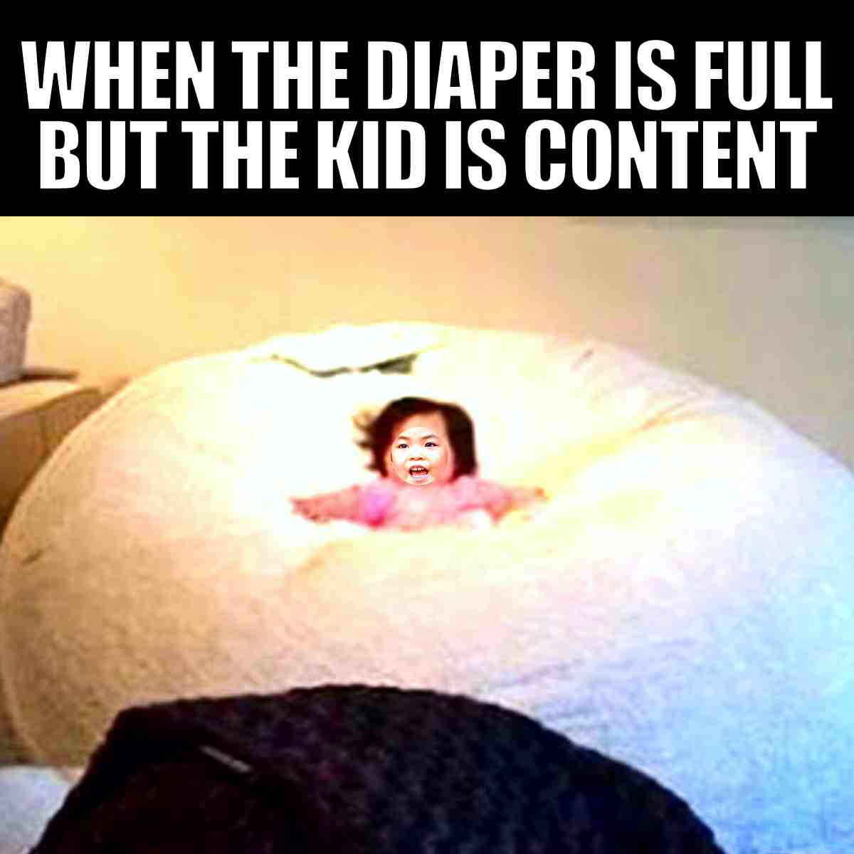 toddler diaper meme A toddler meme featuring a baby contentedly sitting on a giant beanbag with the text 'When the diaper is full but the kid is content.' Humor focuses on the contrast between the peaceful baby and the implied diaper situation, highlighting the amusing side of toddler life.