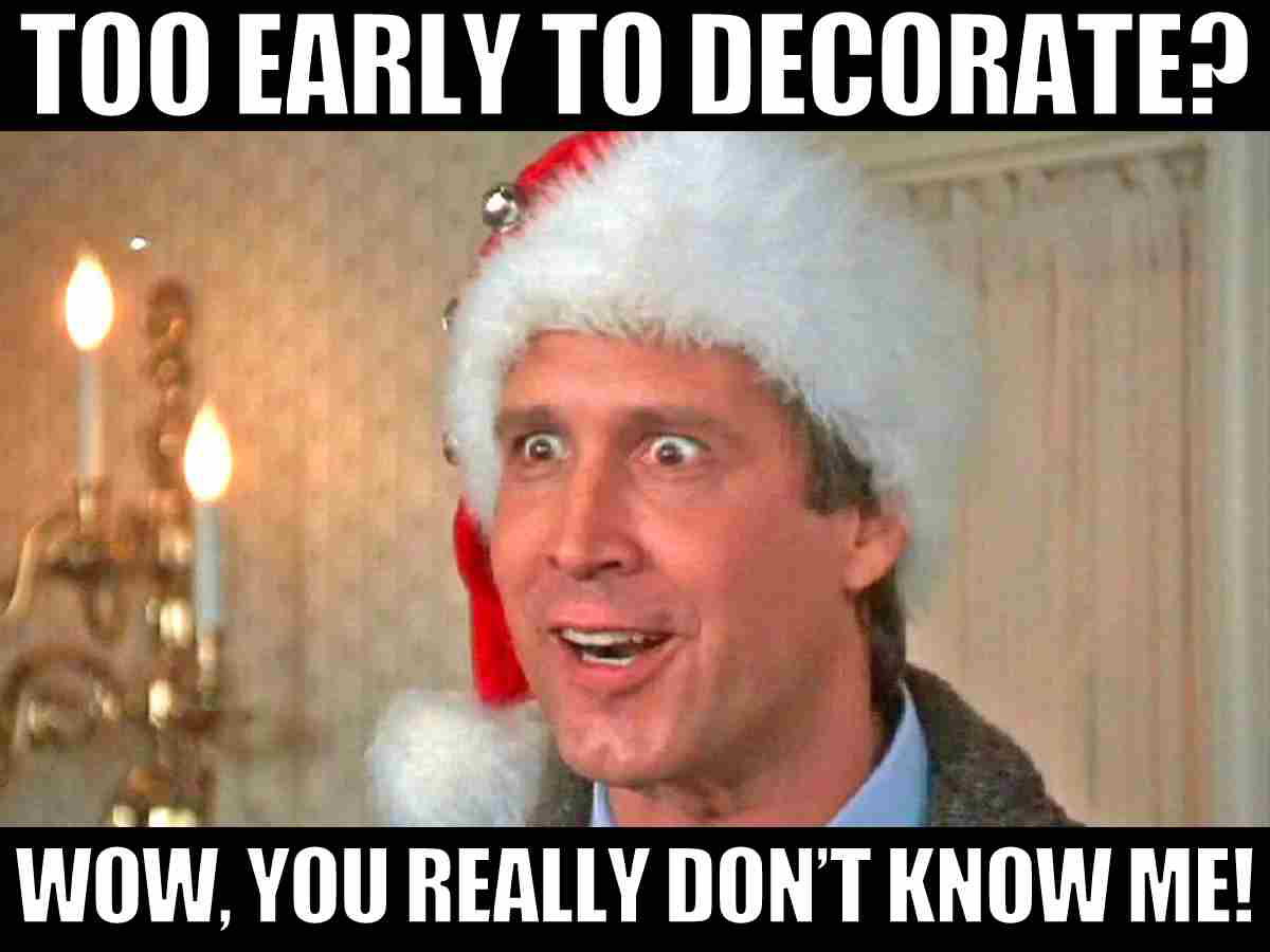 too early to decorate for christmas meme clark Christmas meme with a man wearing a Santa hat, looking wideeyed and excited, captioned 'Too early to decorate? Wow, you really don’t know me!' highlighting holiday enthusiasm.