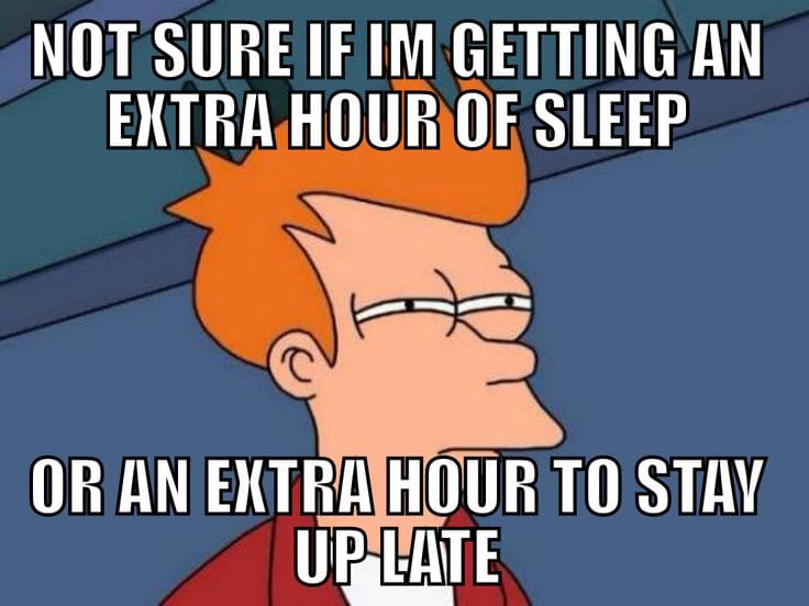 daylight savings time sleep meme Funny meme with a cartoon character squinting, captioned 'Not sure if I'm getting an extra hour of sleep or an extra hour to stay up late,' playing on the classic sleep dilemma.