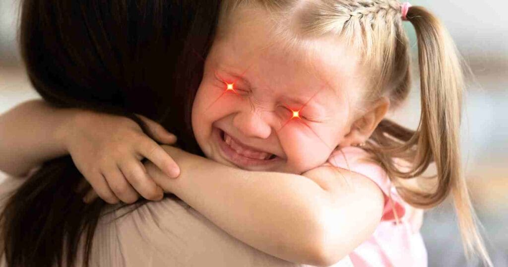 Meme of a young girl hugging someone tightly with glowing red laser eyes, humorously capturing the fierce determination of kids when bedtime is mentioned.