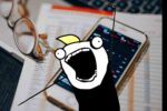 Cartoon character with an exaggerated excited expression standing in front of a smartphone displaying stock market data and a pair of glasses resting on a financial report.