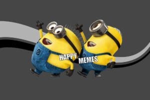 Two joyful yellow characters from an animated movie, wearing goggles and denim overalls, dance with arms raised under the text 'Happy Memes,' spreading infectious cheer.