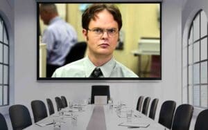 Meme of a seriouslooking man on a boardroom screen, perfectly capturing your face when the meeting could've been an email.