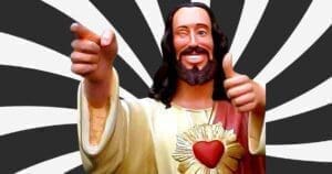 Funny Jesus meme with a statue winking and giving thumbs up against a black and white sunburst background, spreading divine approval with a dose of humor.