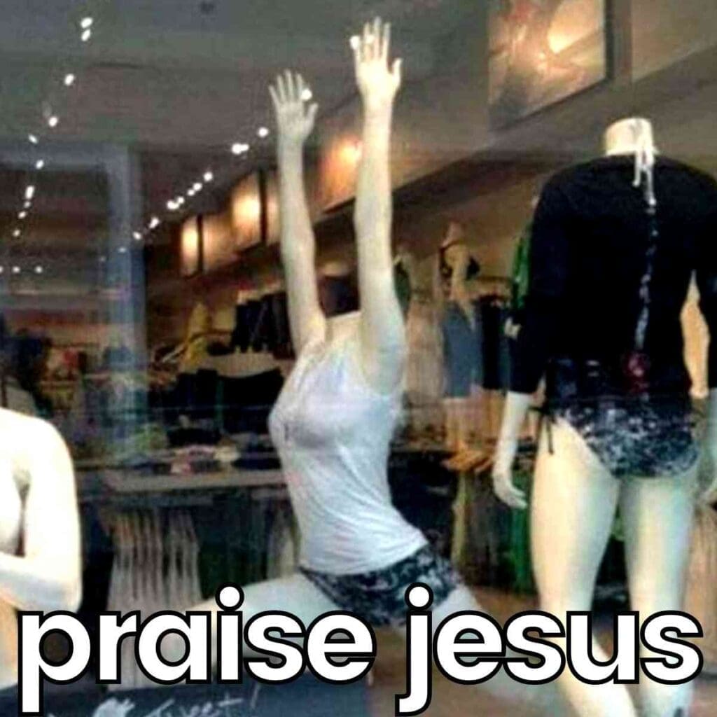 praise jesus meme A humorous meme featuring a headless mannequin in a shop window with arms raised in a 'praise Jesus' pose, with the caption 'praise jesus' emphasizing the comical gesture.