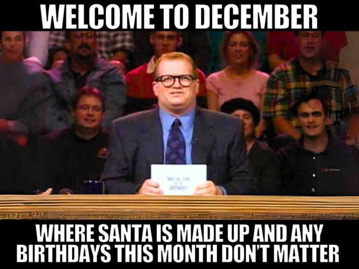 welcome to december meme Meme featuring a man holding a card with a humorous text about December birthdays being overshadowed by Santa, with an audience in the background cheering on this playful jab at holiday-born folks.