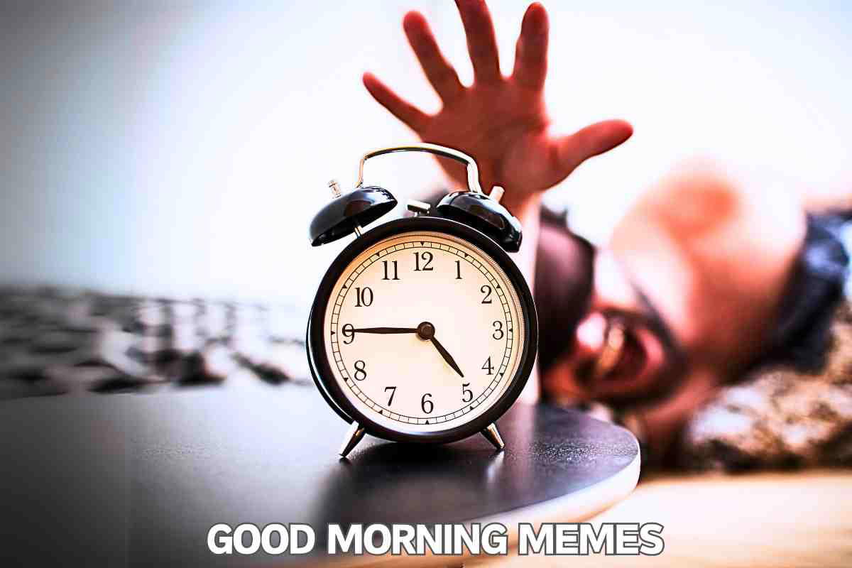 good morning memes An analog alarm clock on a bedside table with a hand reaching out in the blurred background, and the text 'GOOD MORNING MEMES' at the bottom.