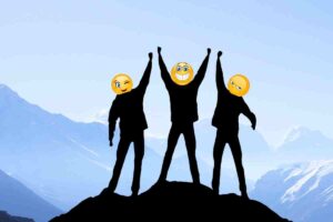 Meme of three silhouetted figures on a mountain top, each with a large emoji face, celebrating a team victory with emojistyle enthusiasm.