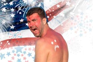 man with sunburn with fireworks and usa flag representing independence day memes for july 4th celebration
