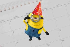 A playful birthday meme featuring a Minion in a party hat saluting in front of a calendar, ready to celebrate with its trademark cuteness and a sprinkle of chaos.