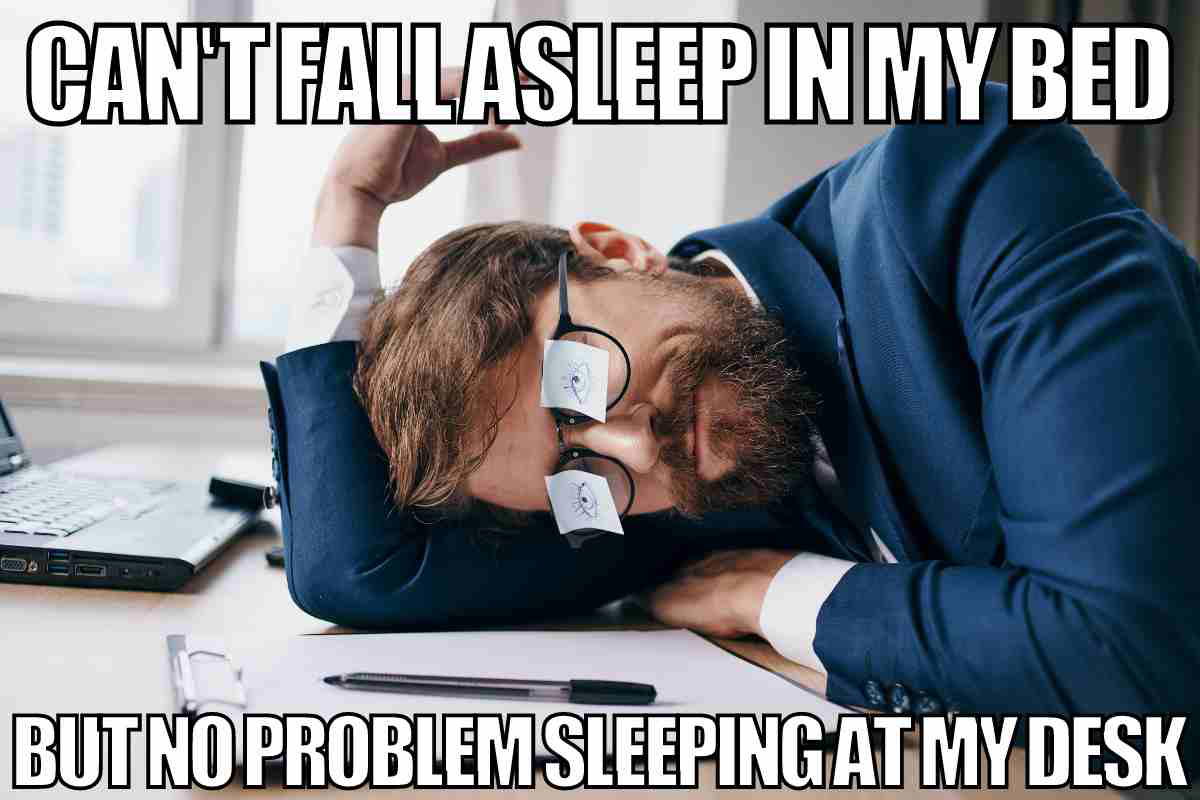 work nap meme A work meme featuring a man in a suit sleeping at his desk with sticky notes as makeshift eyes, captioned 'Can't fall asleep in my bed but no problem sleeping at my desk.' Humorously captures office life irony.