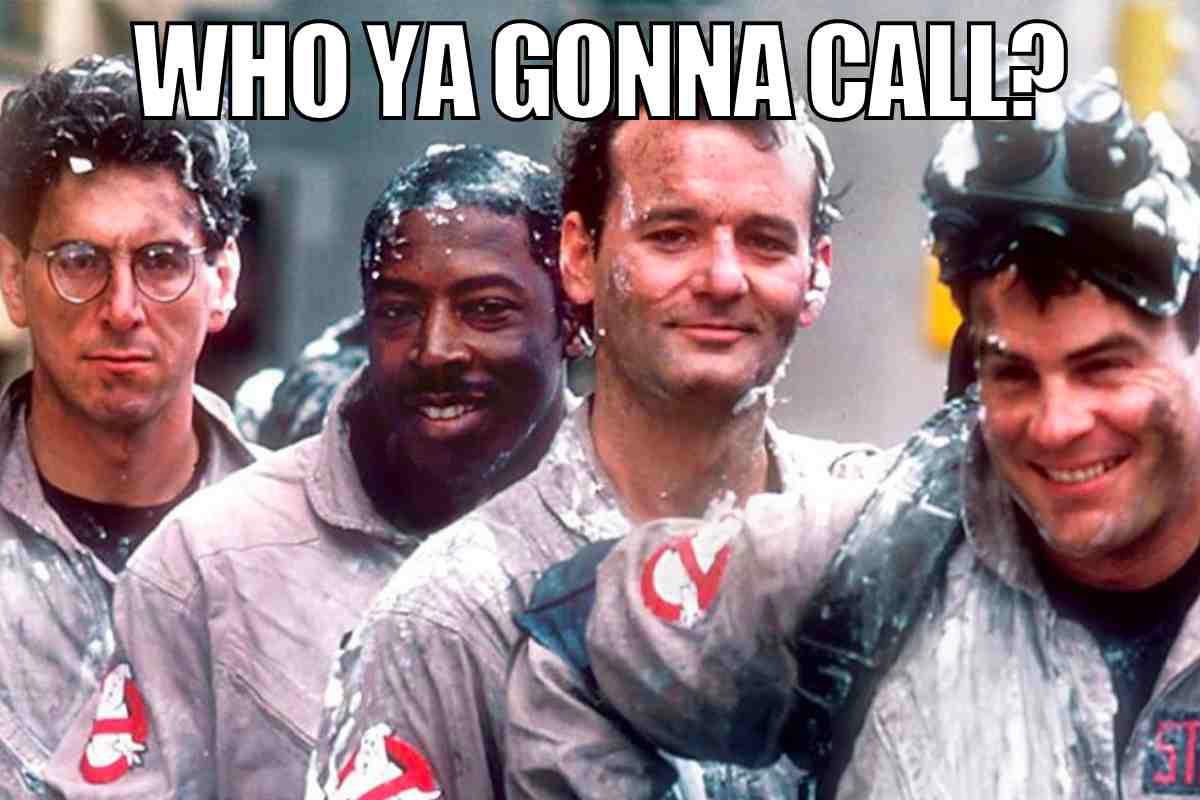 ghostbusters meme Hilarious Ghostbusters meme with four guys in grey suits covered in slime, asking 'Who ya gonna call?' as they smile confidently at the camera.
