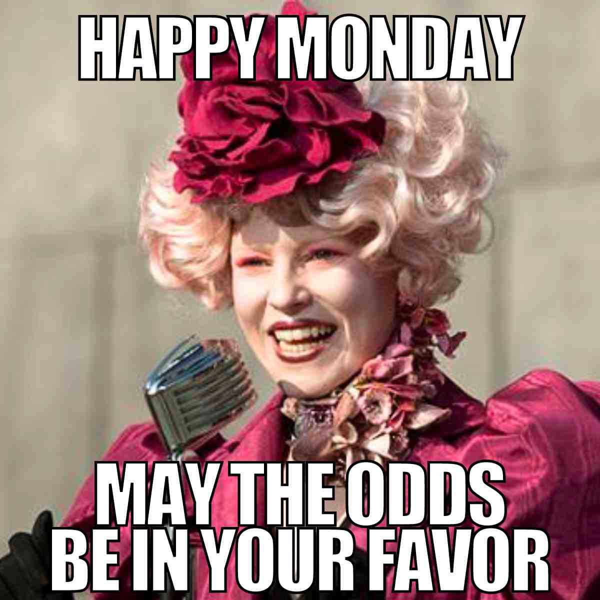 happy monday work meme Meme of a flamboyantly dressed character wishing you a 'Happy Monday' with the foreboding message 'May the odds be in your favor,' humorously implying Monday's challenges await.