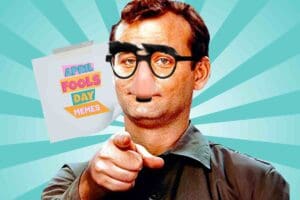 A humorous April Fools' Day meme featuring a person in a classic disguise with fake glasses and a nose, pointing as if to say, 'Gotcha!' with a note in the background reading 'April Fools Day Memes.'