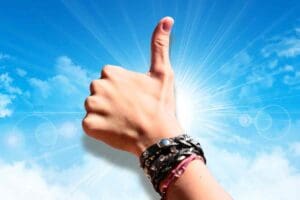 Meme of a hand giving a thumbs up against a sunny sky, ironically suggesting everything's awesome on a Monday morning—because who are we kidding?