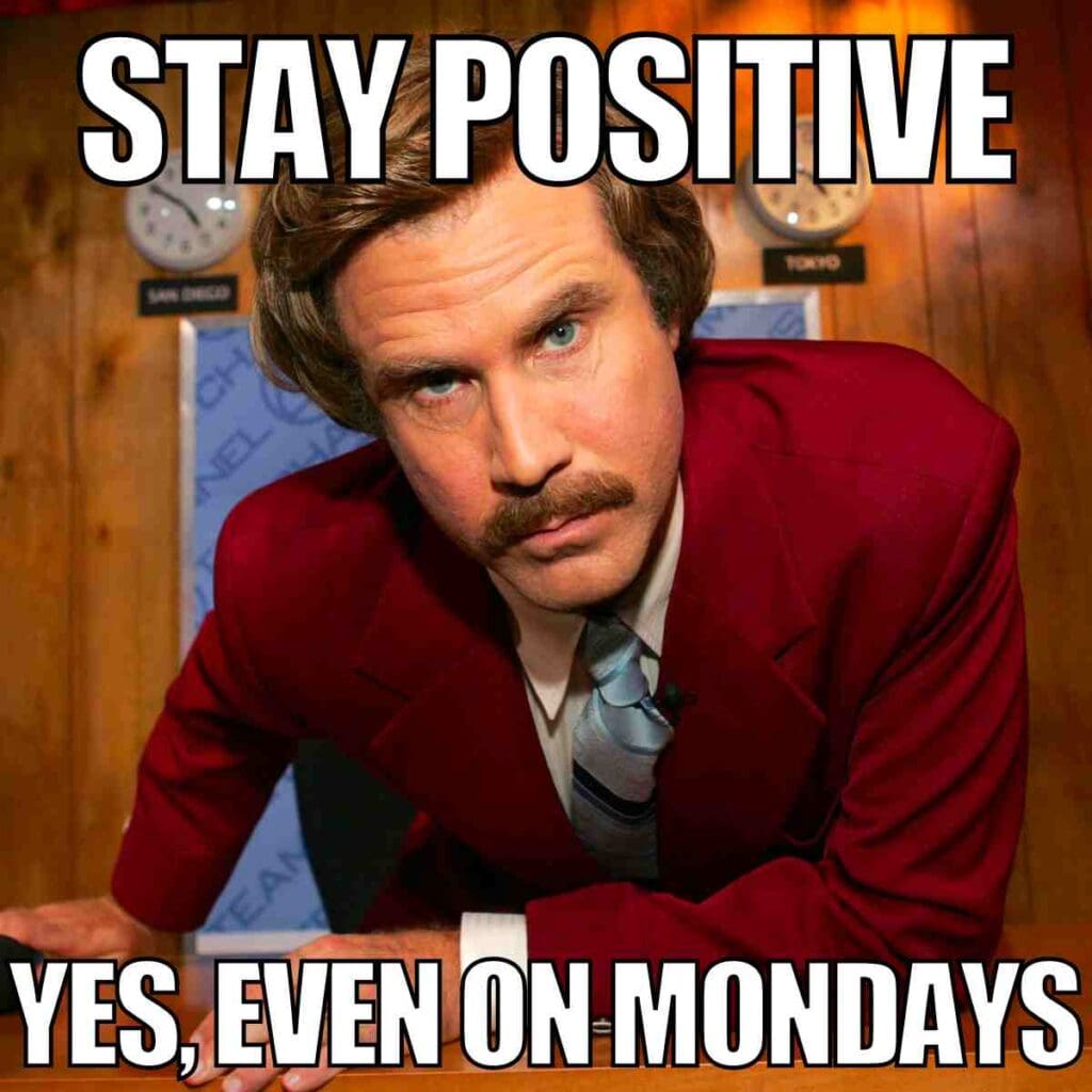 stay positive monday meme Meme featuring a sharply dressed man with a confident expression and the text 'Stay Positive, Yes, Even on Mondays,' humorously encouraging optimism at the start of the week.
