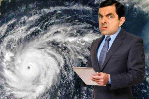 Meme of a man in a suit looking confused at a map of a hurricane, as if he's questioning his career choices as a weatherman.