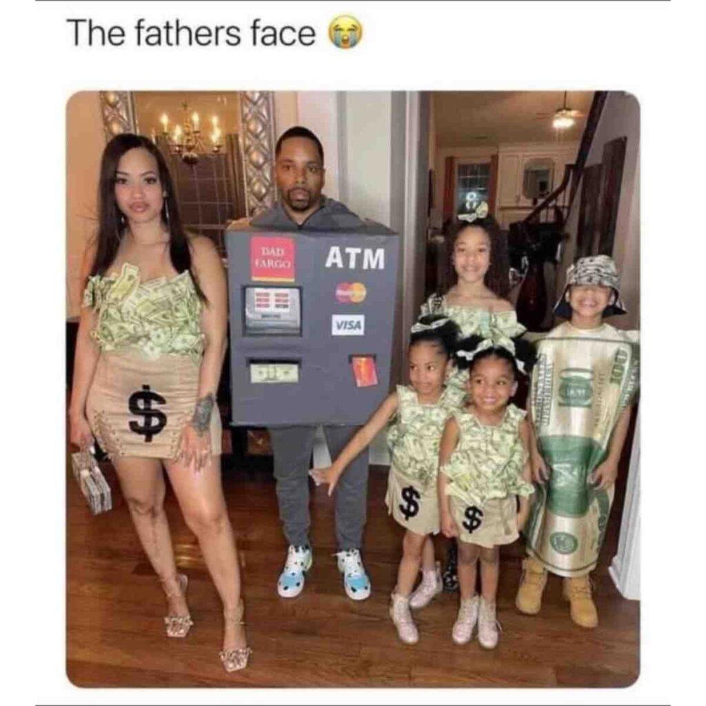 atm dad money meme A man dressed as an ATM machine stands with a woman and children. The woman and children are dressed in outfits made to look like money, with dollar signs and currency print, while the man has a resigned expression.