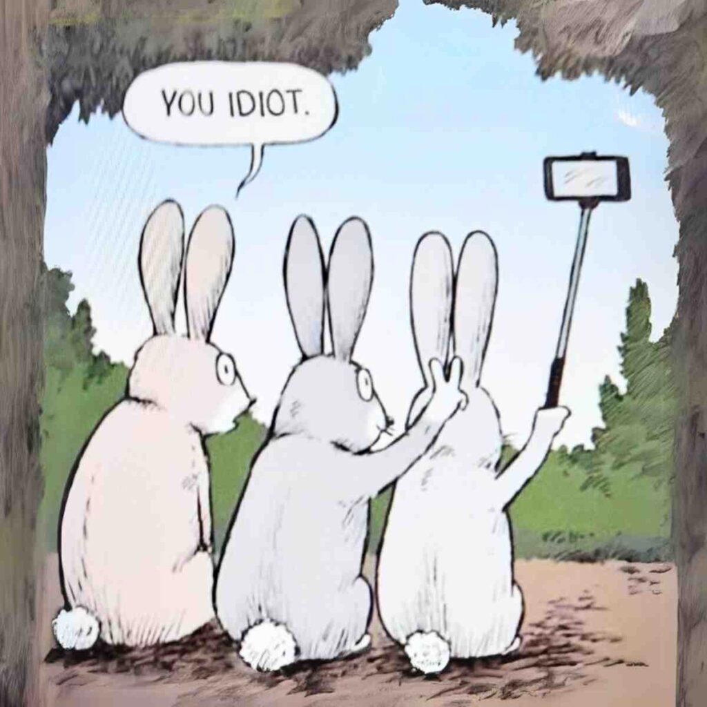 bunny ears meme Three cartoon rabbits sitting in a row, with the middle rabbit making a peace sign behind the third rabbit's head while it takes a selfie. The first rabbit on the left looks at them and says, "You idiot."