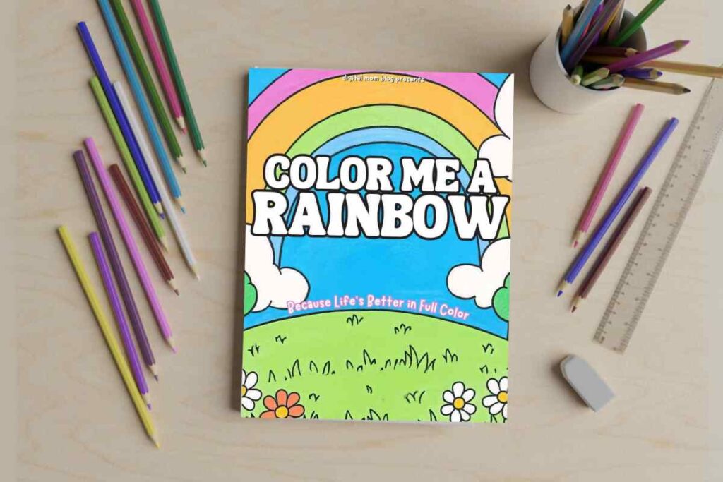color me rainbow coloring book printable A coloring book titled "Color Me a Rainbow" with a colorful rainbow and clouds on the cover, surrounded by colored pencils, a ruler, an eraser, and a cup holding more pencils on a wooden table.