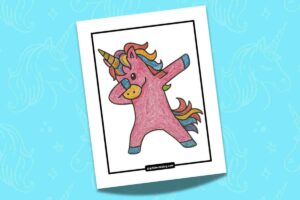 A colorful drawing of a unicorn doing the dabbing dance pose. The unicorn is pink with a rainbow mane and tail, and it has its left arm bent across its face and right arm pointing upwards. The drawing is set against a light blue background featuring subtle unicorn patterns.