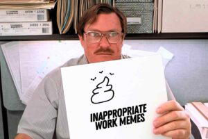 A man with glasses and a mustache sitting in an office cubicle, holding a piece of paper with a doodle of a poop emoji and the text "INAPPROPRIATE WORK MEMES."